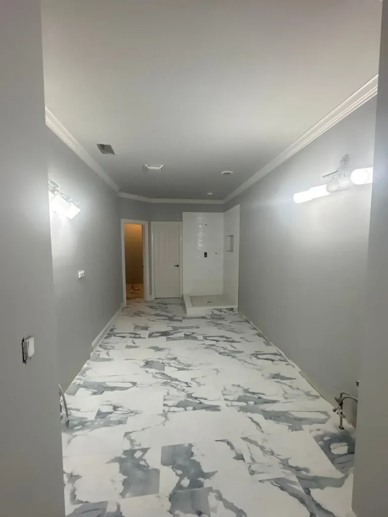Bathroom walls and ceiling painted light gray beside marble tile — MG Barillas Painting