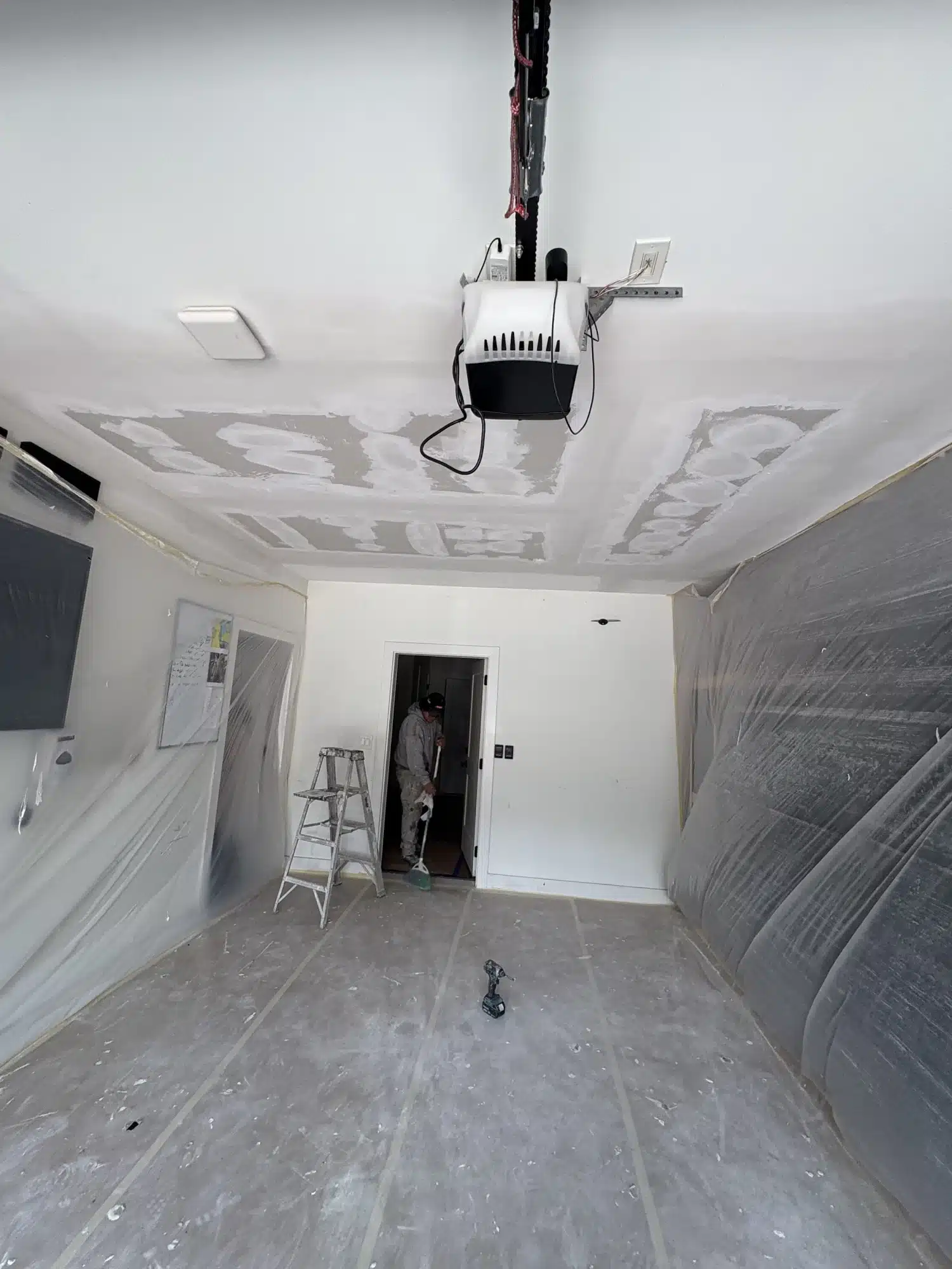 Ceiling texture removal in a room sealed with plastic — MG Barillas Painting