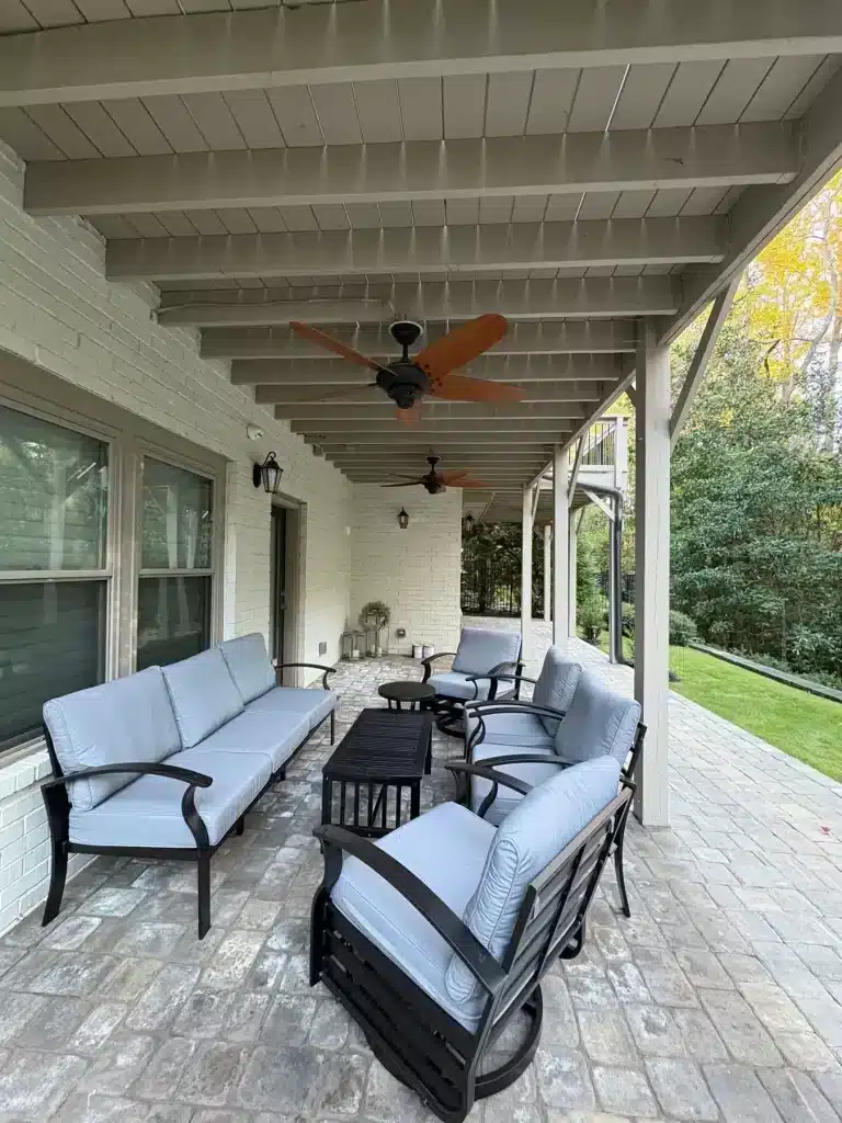 Covered patio with a freshly painted beam ceiling and painted white brick — MG Barillas Painting