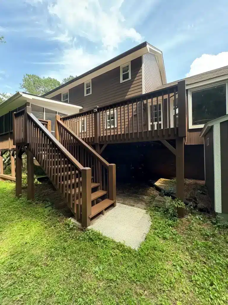 Elevated deck and staircase stained brown to match the siding — MG Barillas Painting