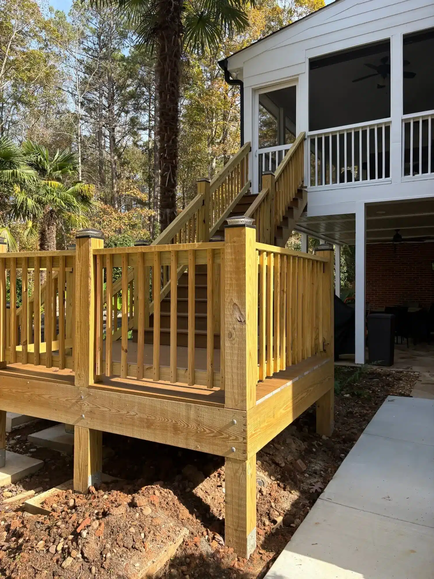 Before: New wood deck landing and railings before painting