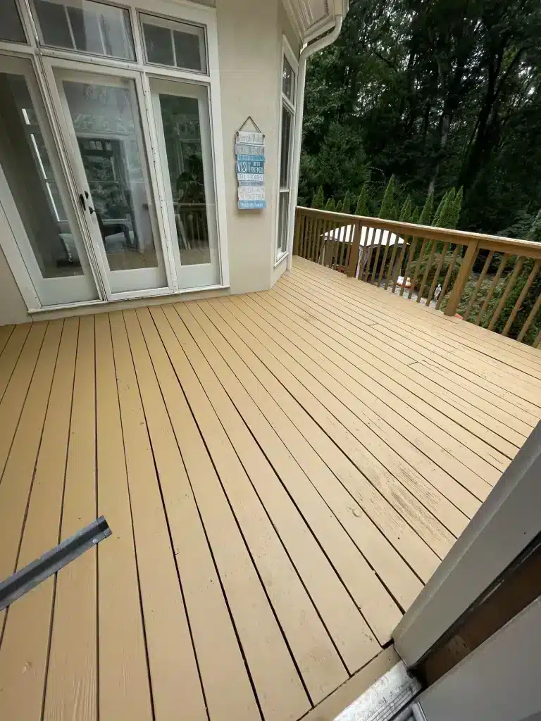 Deck stained a warm tan with matching railings — MG Barillas Painting