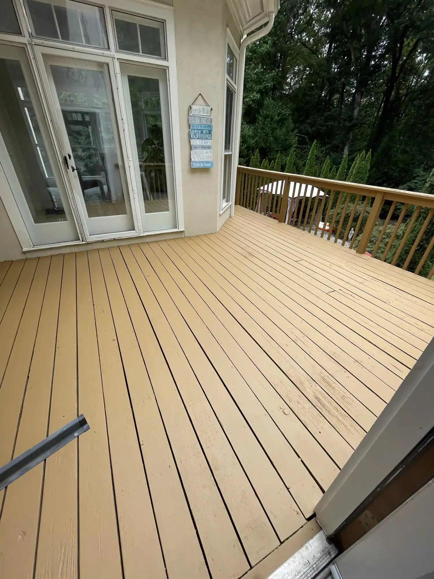 Deck stained a warm tan with matching railings — MG Barillas Painting