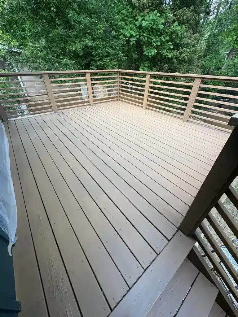 Deck stained warm tan with horizontal railings — MG Barillas Painting