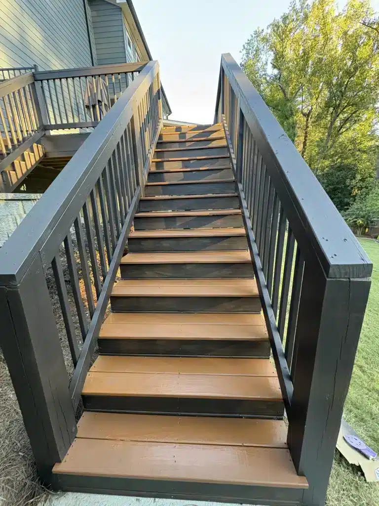 Exterior staircase painted charcoal with stained treads — MG Barillas Painting