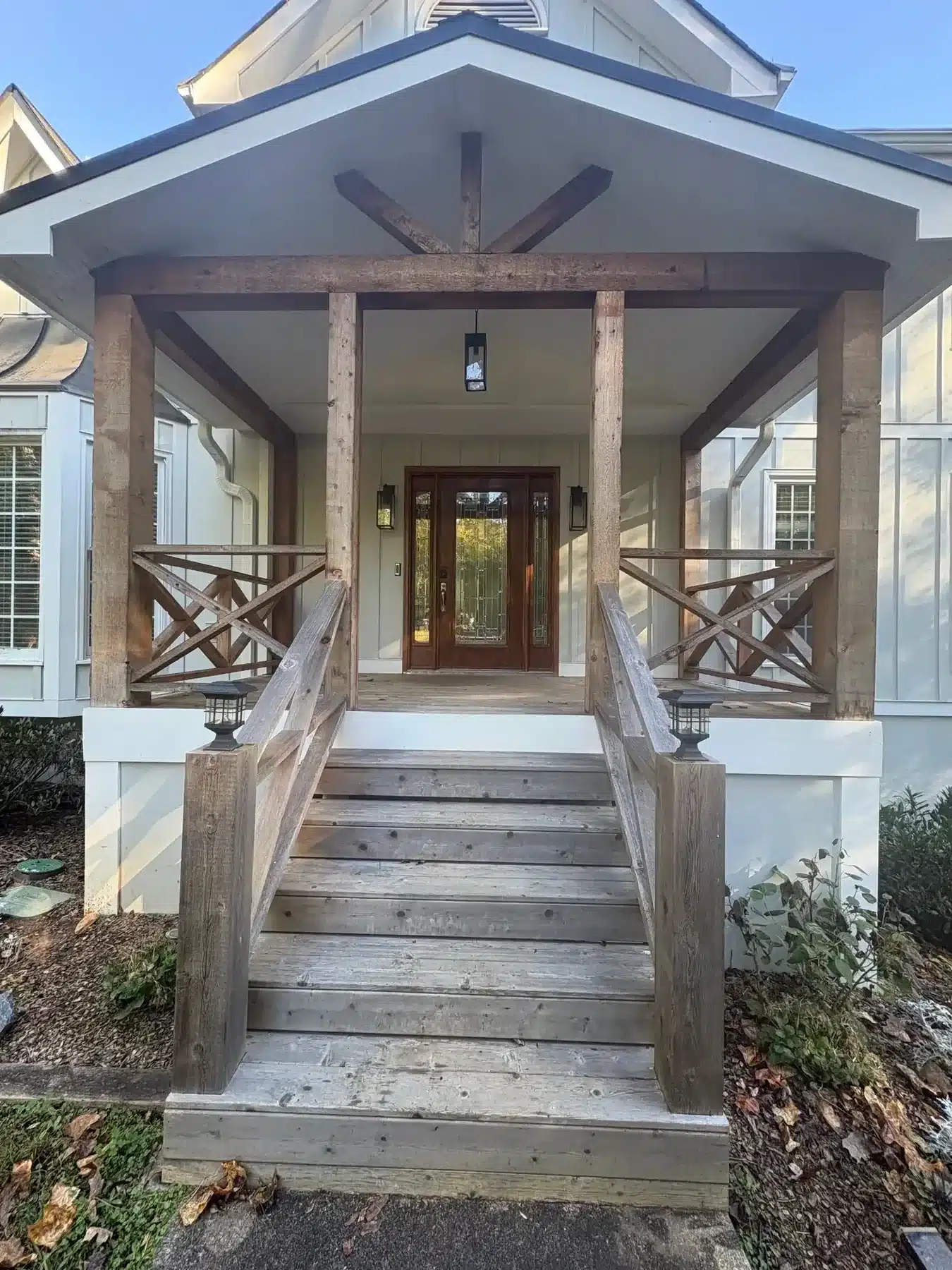 Before: Front porch with weathered gray cedar before staining