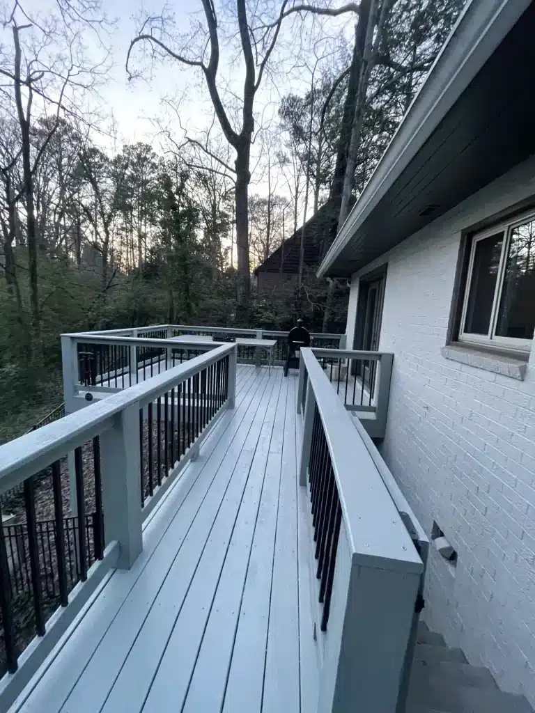 Long gray deck walkway with black railings — MG Barillas Painting