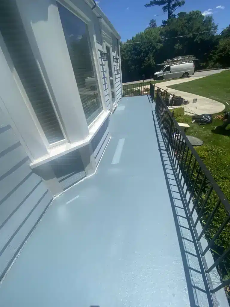 Porch floor finished with a light blue protective coating — MG Barillas Painting