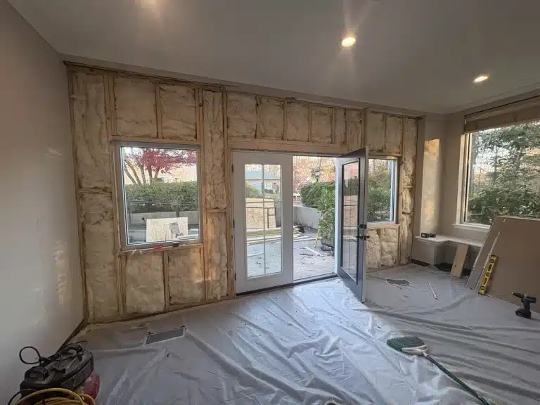 Room prepped for drywall and paint with floors protected — MG Barillas Painting