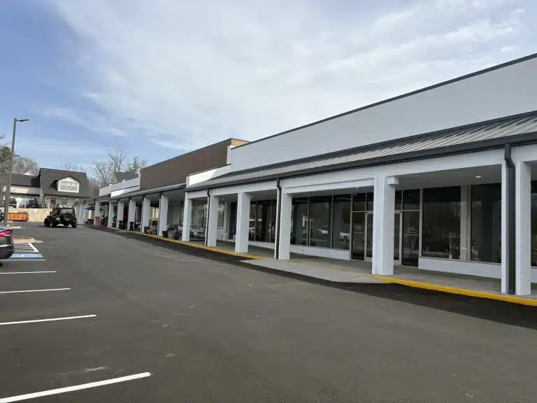 Shopping center exterior repainted white — MG Barillas Painting