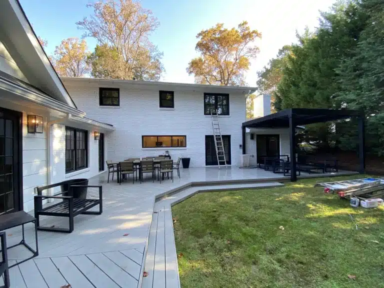 White home with a newly painted gray deck and patio — MG Barillas Painting